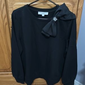 Black sweater size large with accent bow